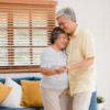 asian elderly couple dancing together while listen music living room home sweet couple enjoy love moment while having fun when relaxed home