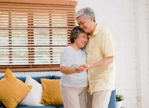 asian elderly couple dancing together while listen music living room home sweet couple enjoy love moment while having fun when relaxed home